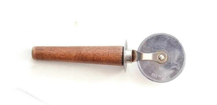 Pizza cutter with wooden handle.