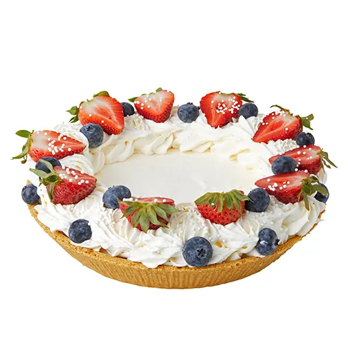 Cream pie with strawberries and blueberries on top.
