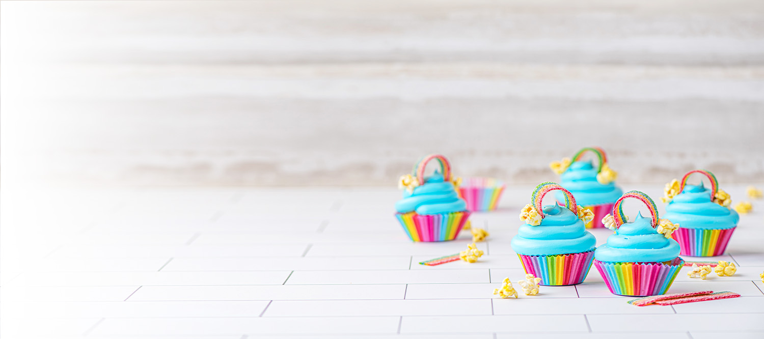 Bettercreme whipped icing on cupcakes with vibrant colors.