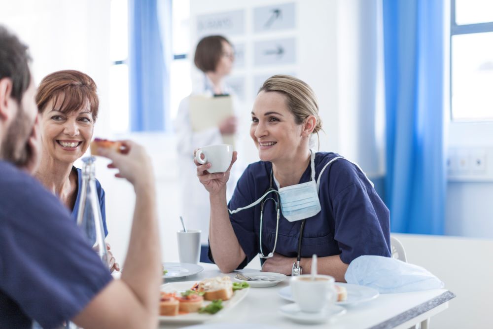 Medical staff talking over food