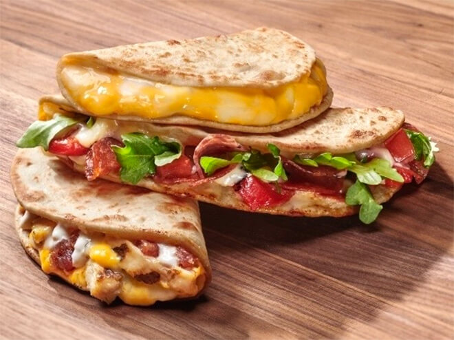 pizza crust being used as a quesadilla