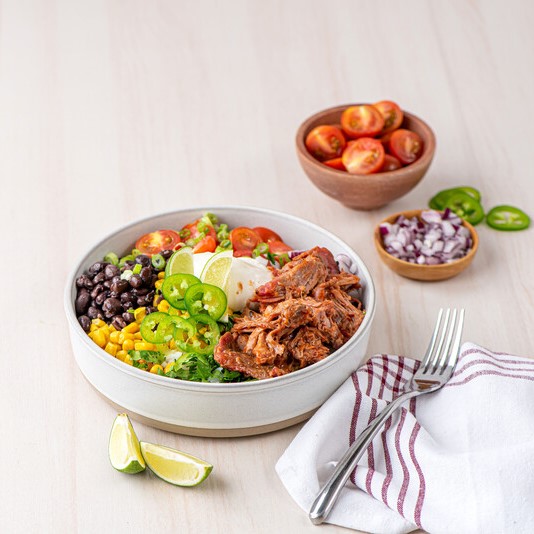 Pulled pork BBQ protein bowl on table
