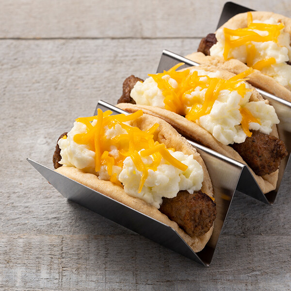 Breakfast tacos in stands.