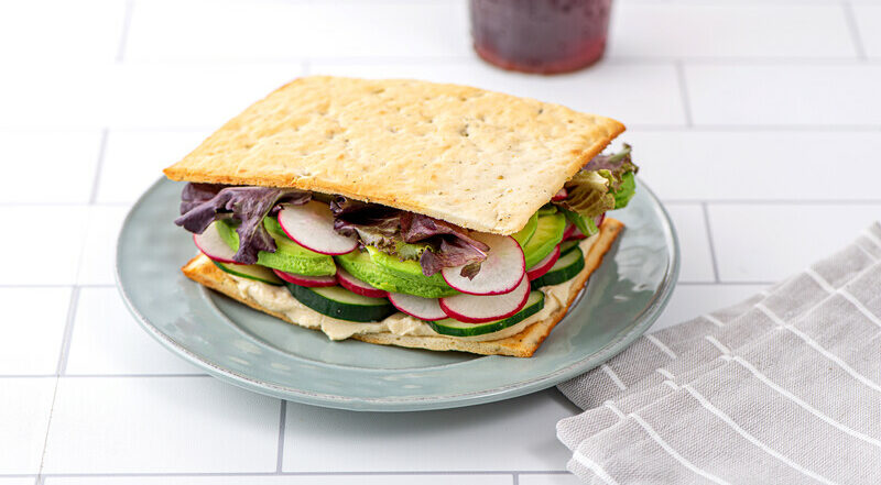 Gluten free veggie flatbread sandwich on plate