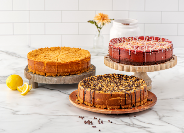 Whole cheesecakes on plates