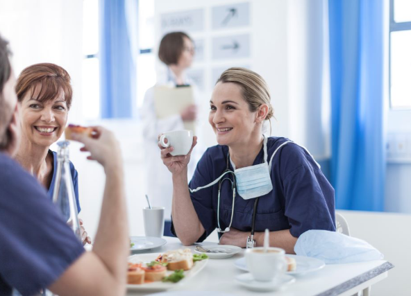 healthcare staff eating at a table