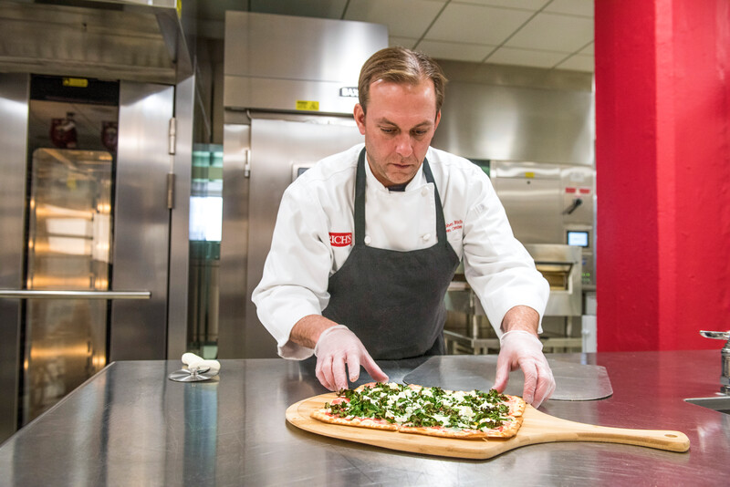 chef working on pizza