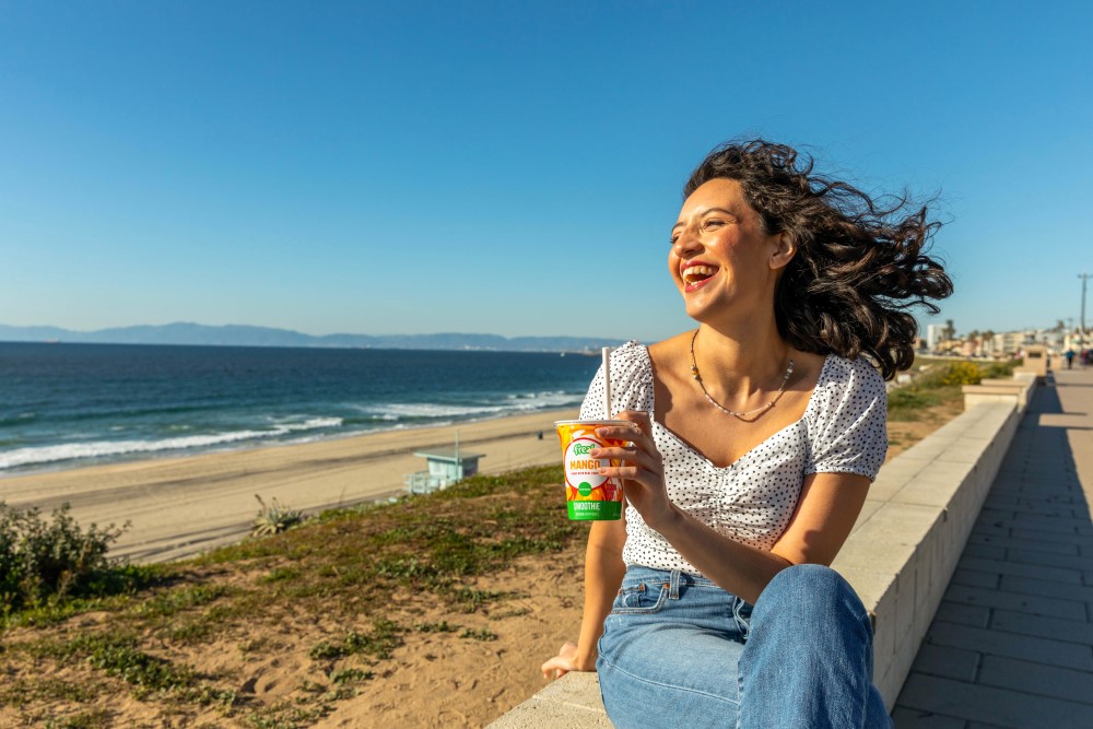 woman drinking freal smoothie