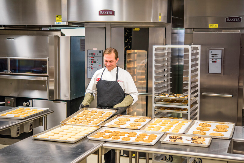 chef looking at cookies
