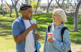 college students drinking f'real milkshakes