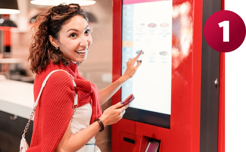 woman ordering at screen