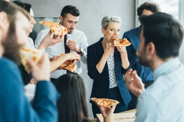 business people eating pizza