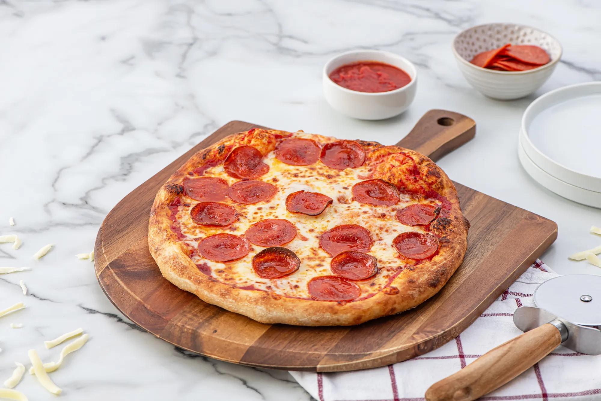 Pepperoni Pizza on a wooden tray