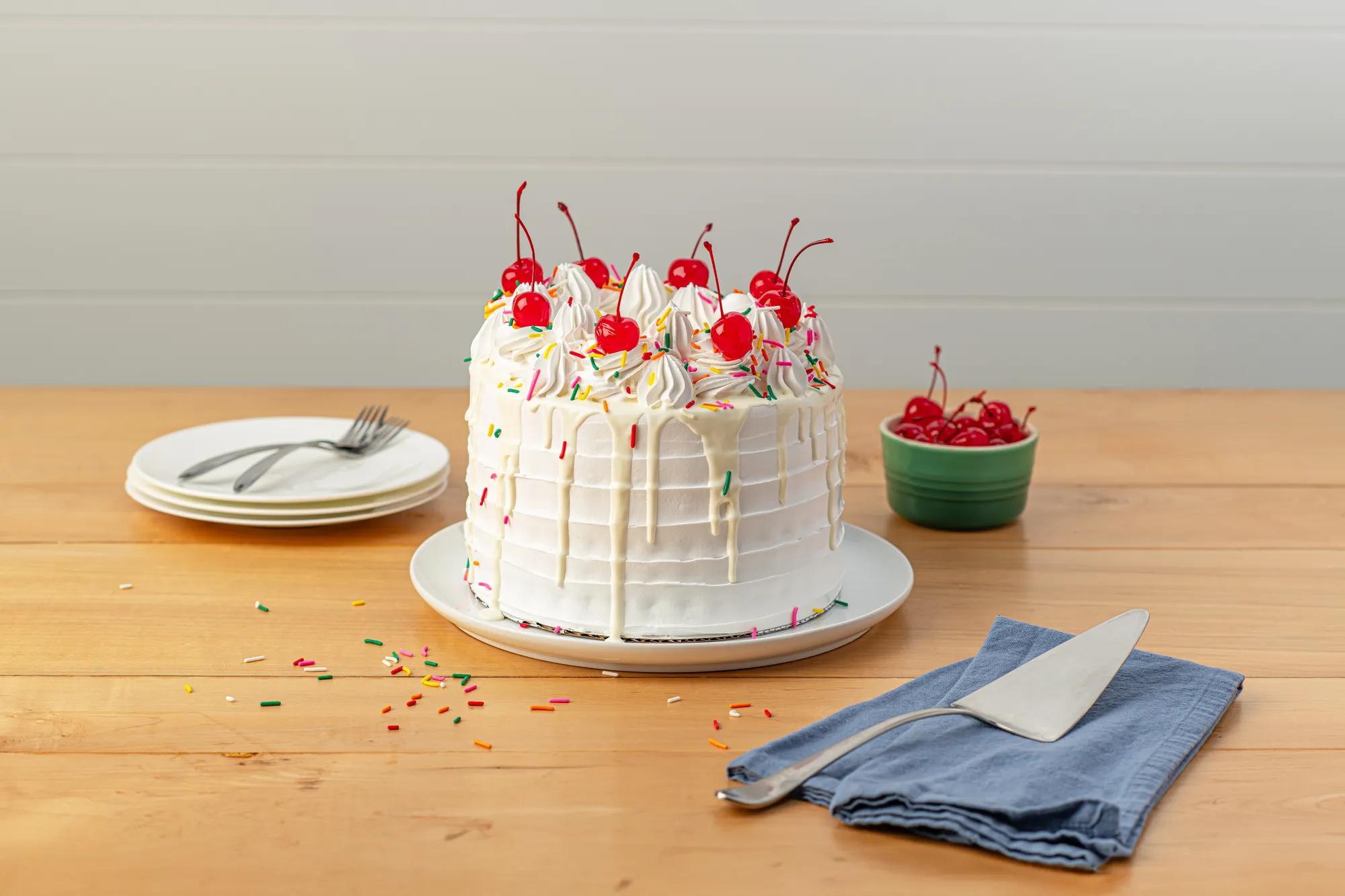 White Cakes with Cherries and Rainbow sprinkles